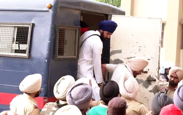 Amritsar, Mar 19 (ANI): Seven supporters of 'Waris Punjab De' chief Amritpal Singh brought to court after being arrested, at Beas, in Amritsar on Sunday. (ANI Photo)