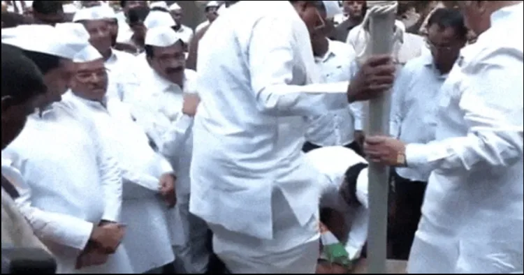 Karnataka congress worker taking off Siddharmaiah Shoe