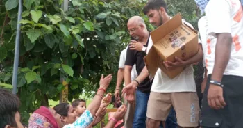 RSS volunteers distributing relief material to flood-affected people in Gurdaspur, Punjab