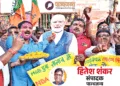 जीत की खुशी मनाते राजग समर्थक