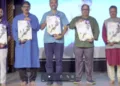 पोस्टर का लोकार्पण करते अतिथि