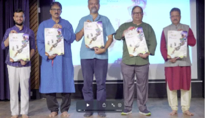 पोस्टर का लोकार्पण करते अतिथि